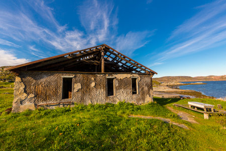 Old abandoned and ruined house at farms land.の写真素材