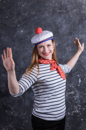 Beautiful midle aged lady having fun in sailors suitの写真素材