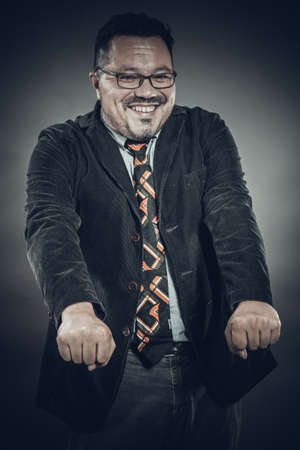 Solid cheerful man in spectacles emotional portraitの写真素材
