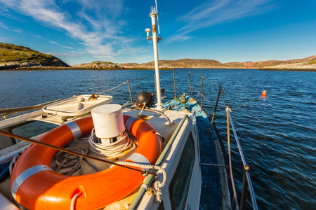 Motorboat in Barents sea view from deck.の写真素材