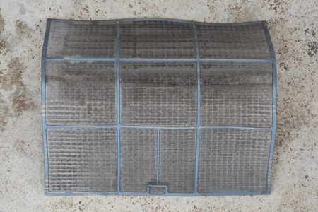air conditioner filter on cement floorの写真素材