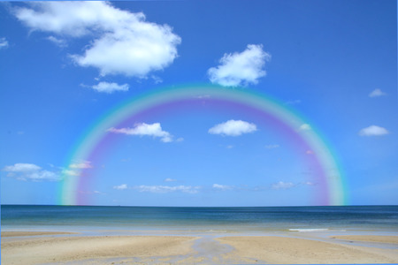 Colorful rainbow over a Tropical beach of Andaman Sea Thailandの写真素材