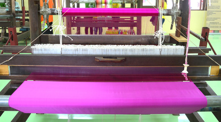 Weaving loom and shuttle on the warp.の写真素材