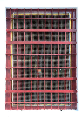 Metal barred or grated security installed on windowの写真素材