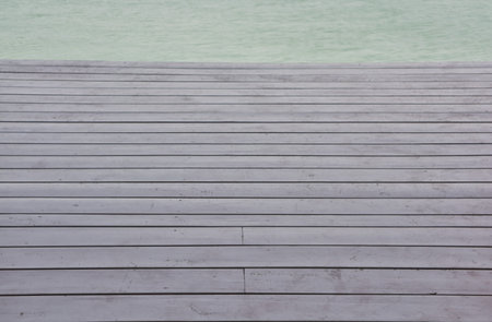 wooden platform beside blue sky beach
