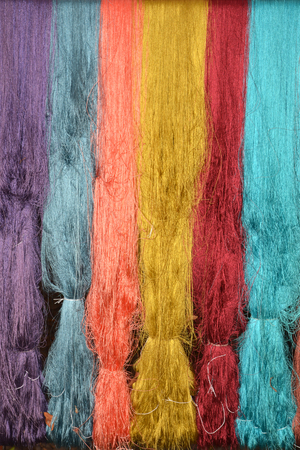 colorful of raw multicolor silk thread backgroundの写真素材