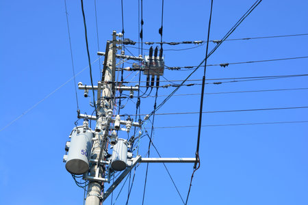 electricity transmission pylon against blue sky