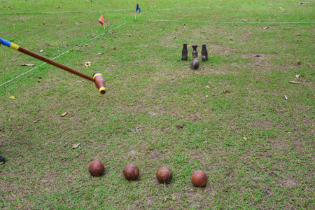 Sports Woodball a way to play a sport like golfWoodball is played with a mallet whose head looks remarkably like a wooden beer bottle. And whose wickets look like a wooden beer glass suspended between two more wooden bottles.の写真素材