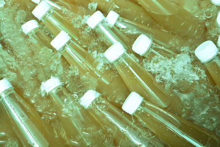 Sugar cane juice in a bottle on ice