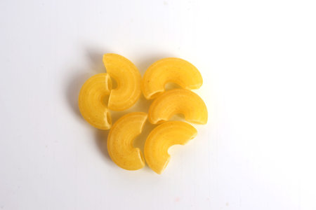 Macro photo food product raw eibow macaroni Vermicelli on white background