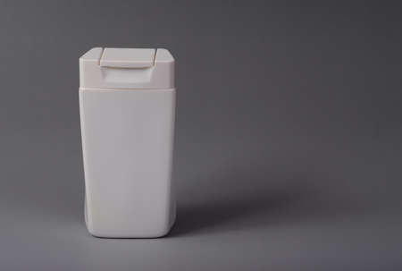 still life product shampoo plastic packaging on gray backgroundの写真素材