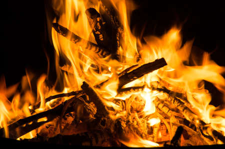 Fascinating flames in a fire bowl, burning campfireの写真素材