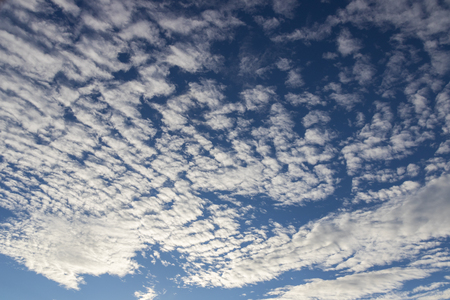 blue sky background with tiny cloudsの写真素材