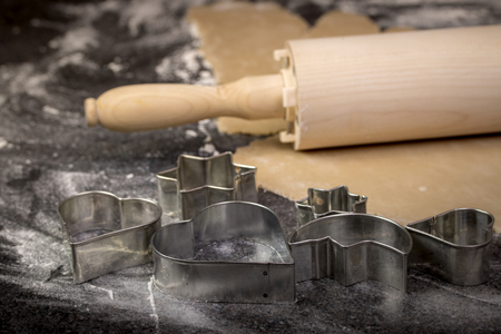 Preparing Christmas cookie dough using a rolling pin to prepare the doughの写真素材