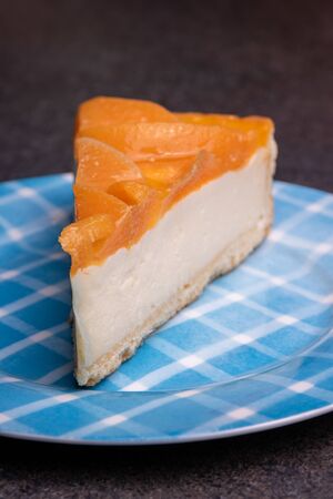 Peach creramy cake topped with jelly, peace of peach cake closeupの写真素材