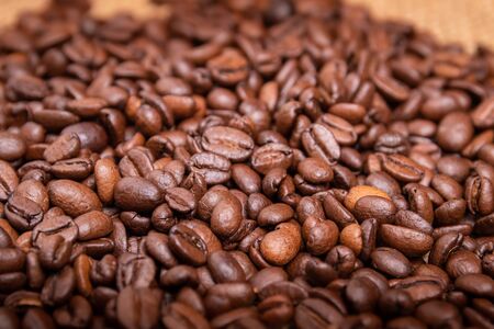 Cup of coffee, bag and scoop on old backgroundの写真素材