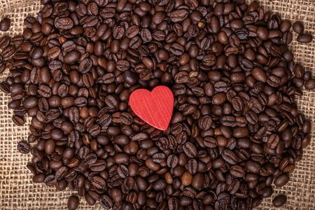 Cup of coffee, bag and scoop on old backgroundの写真素材