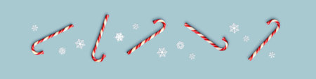 Set of Christmas candies on blue background. Border with colorful holiday sweets and snowflakes. X...