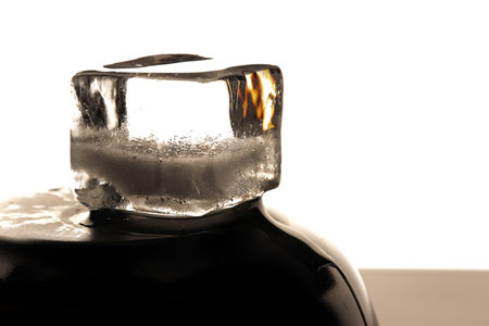 Ice cube on black background. low key photo. close upの写真素材