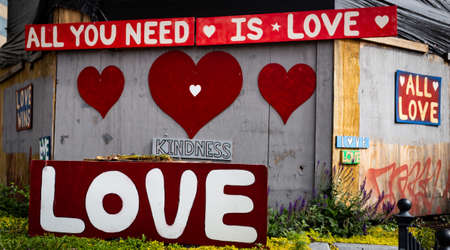 Various signs stating love displayed around concrete structureの写真素材