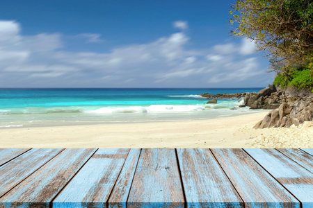 Wooden Table Top With Blurred Natural Sea Tropical Beach Blue Sky Summer Holiday Background. wood...