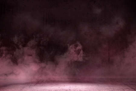 Room with concrete floor and smoke with dark wall backgroundの写真素材