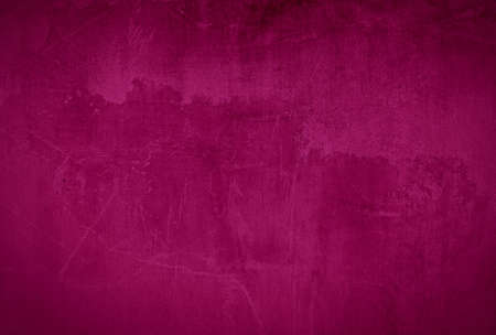 Vintage grunge Pink maroon concrete texture wall background with vignetteの写真素材