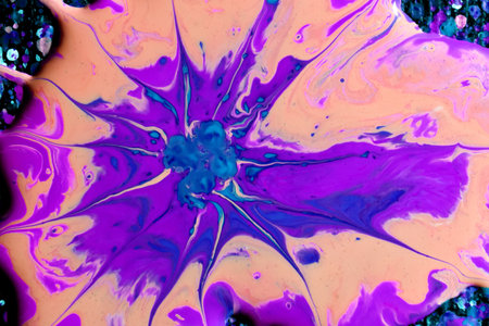 A macro shot of an abstract mixture of colorful acrylic paint splashes on a black backgroundの写真素材