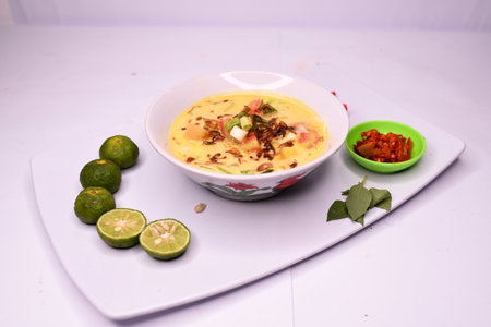 Soto Betawi is a regional specialty from Jakarta, Indonesia, consisting of soup, meat, tomatoes, onions and coconut milkの写真素材