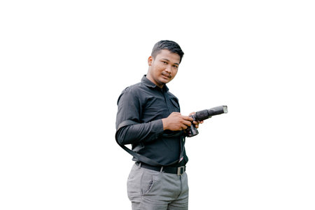 a person in black is holding a camera looking into the lens that takes a picture of him in a studio photoの写真素材