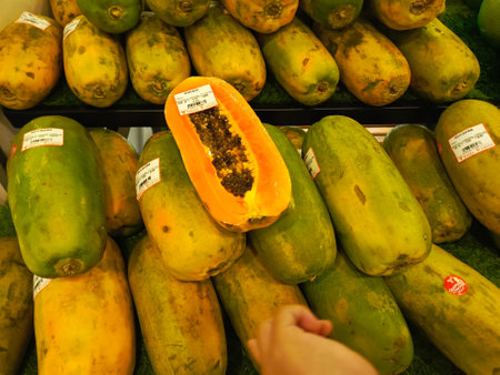 display, farmer, harvest, juicy, produce, sale, sell, shop, agricultural, exotic, health, indonesia, market, nutrients, nutrition, pile, ripe, supermarket, vegetarian, raw, tropical, colorful, eat, healthy, nature, object, orange, papaya, stall, tasty, yellow, agriculture, asia, asian, background, closeup, delicious, dessert, diet, farm, food, fresh, fruit, natural, organic, sweet, carica, carica papaya, medium size, pawpawの写真素材