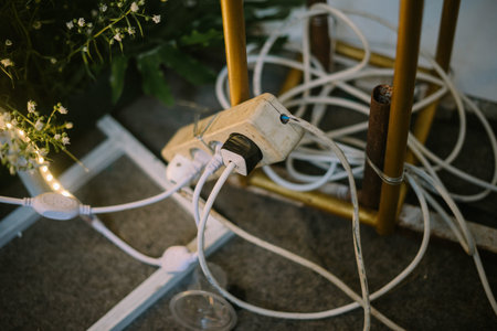 Four-plug electrical outlet with all terminals in use.