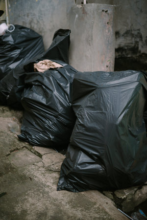 Collected trash bags ready for disposal at the landfill