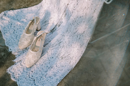 Elegant white gown paired with beautiful high heels, perfect for a sophisticated lookの写真素材