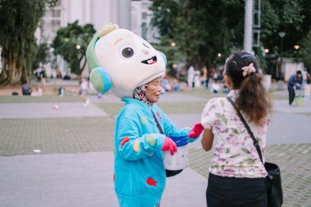 Bogor, July 20 2024. A spacious city square with neatly arranged tiles and grass, where visitors enjoy a pleasant and well-maintained urban environmentのeditorial素材