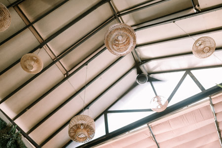 A ceiling with hanging lights exuding a luxurious ambiance, highlighting the elegance of the home. Perfect for themes of interior design, luxury living, and architectural sophisticationの写真素材