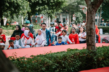 Bogor, August 17 2024. Dozens of people participating in a carnival to celebrate Indonesia's Independence Day, showcasing vibrant costumes and festive spirit, perfect for cultural, event, and celebration projectsのeditorial素材