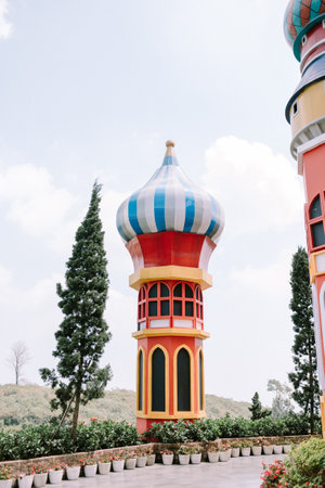A colorful dome-shaped tower with a whimsical design, evoking the enchanting atmosphere of a fairytale theme parkの写真素材