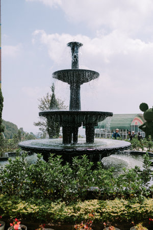 A stunning fountain with water gracefully cascading, creating a visually captivating display and adding elegance to the surrounding space.の写真素材