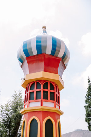 A colorful dome-shaped tower with a whimsical design, evoking the enchanting atmosphere of a fairytale theme parkの写真素材