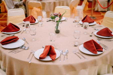 Luxurious hotel dining table set with elegant tableware, showcasing a sophisticated and upscale dining experience.の写真素材