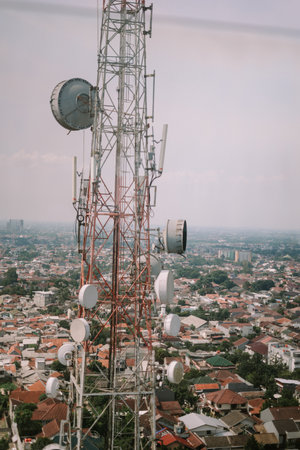A 4G signal tower with antennas and equipment, standing tall against the sky, providing cellular coverage and connectivityの写真素材