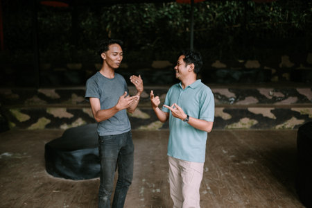 Colorful flip-flops resting on a bed of lush green grass, capturing a relaxed, summer vibe. Perfect for themes of leisure, vacation, and outdoor living.の写真素材