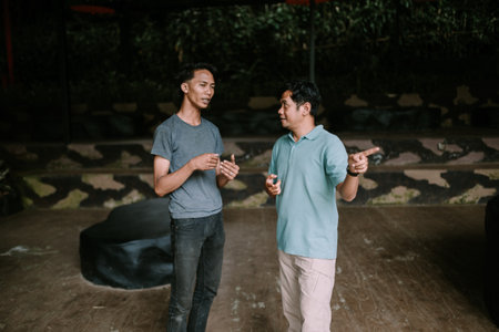 Colorful flip-flops resting on a bed of lush green grass, capturing a relaxed, summer vibe. Perfect for themes of leisure, vacation, and outdoor living.の写真素材