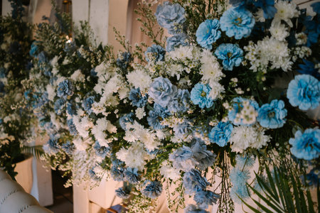 Artificial wedding flowers arranged beautifully, adding elegance and charm to the decor. Perfect for themes of celebration, romance, and event styling.の写真素材