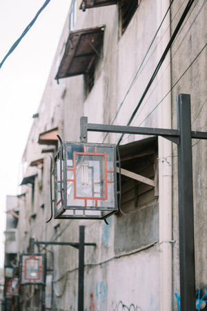 Atmospheric, narrow pedestrian alleyway illuminated by urban lights