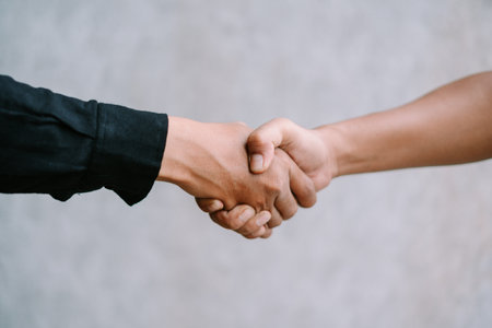 Two people shaking hands in agreement.の写真素材