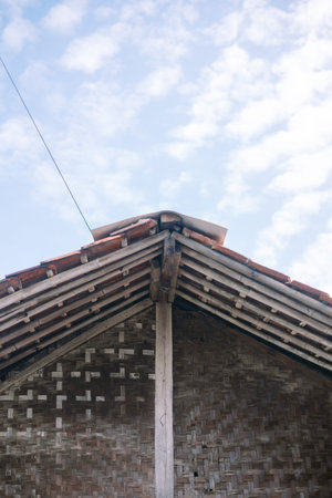 Detail of a traditional bamboo roof, showcasing the intricate craftsmanship and natural materials.