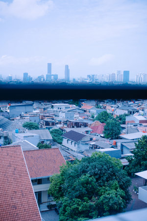 View of a cityscape with various buildings and rooftops.