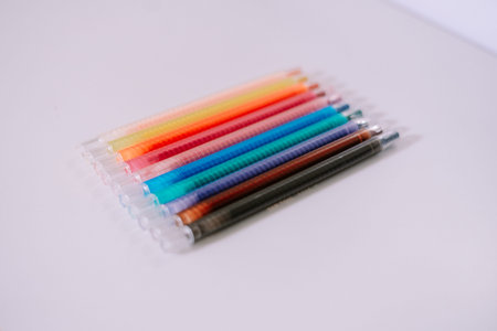 Image of a set of multicolored gel pens. Excellent for illustrating themes relating to drawing, writing, stationery, office or education.の写真素材